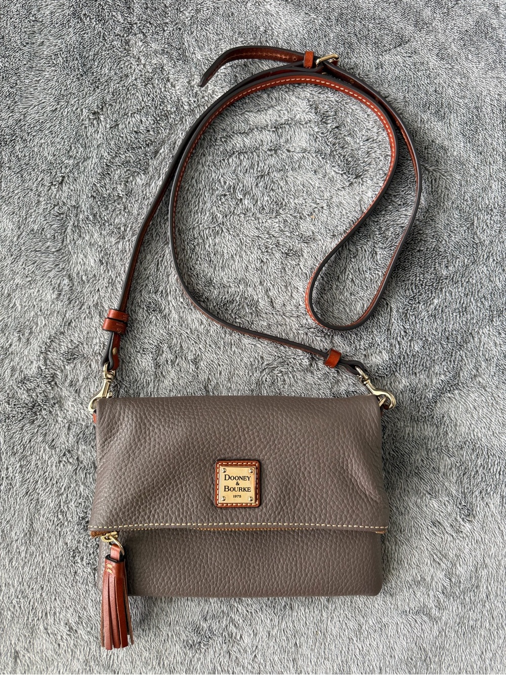 New without tag.Dooney & Bourke Taupe Pebble Leather Crossbody with Tan Trim